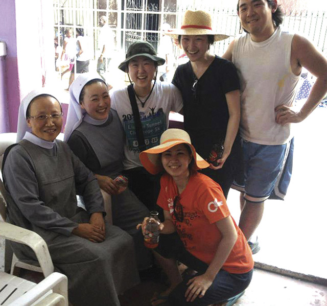 Lee with the sisters and volunteers she met in Haiti who inspired her to become a sister herself. 