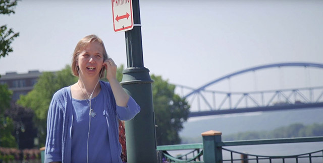 Sister Sarah Hennessey, F.S.P.A. stands near a bridge